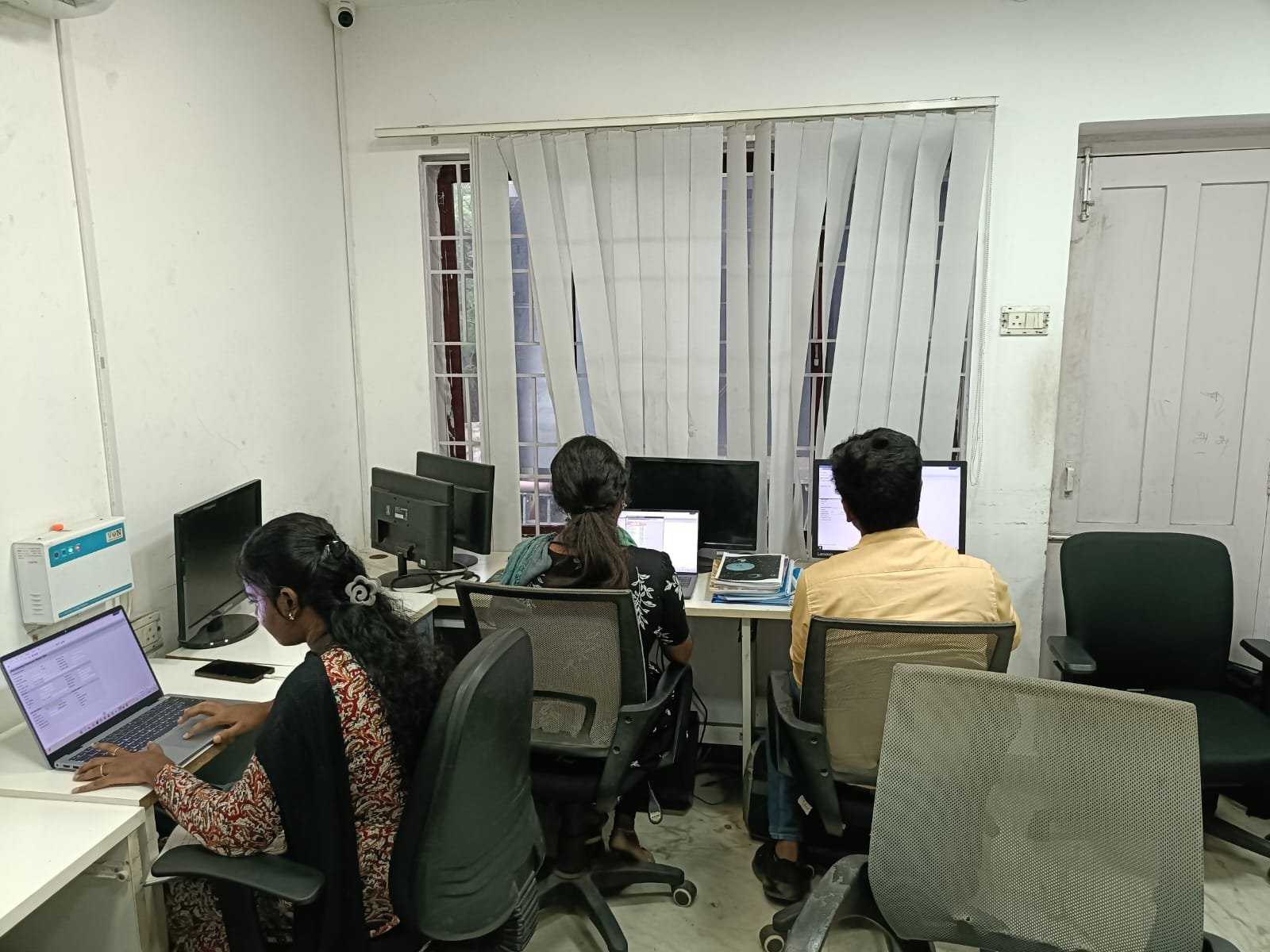 Students at a Techmaax centre working through lab exercises on their laptops and desktops