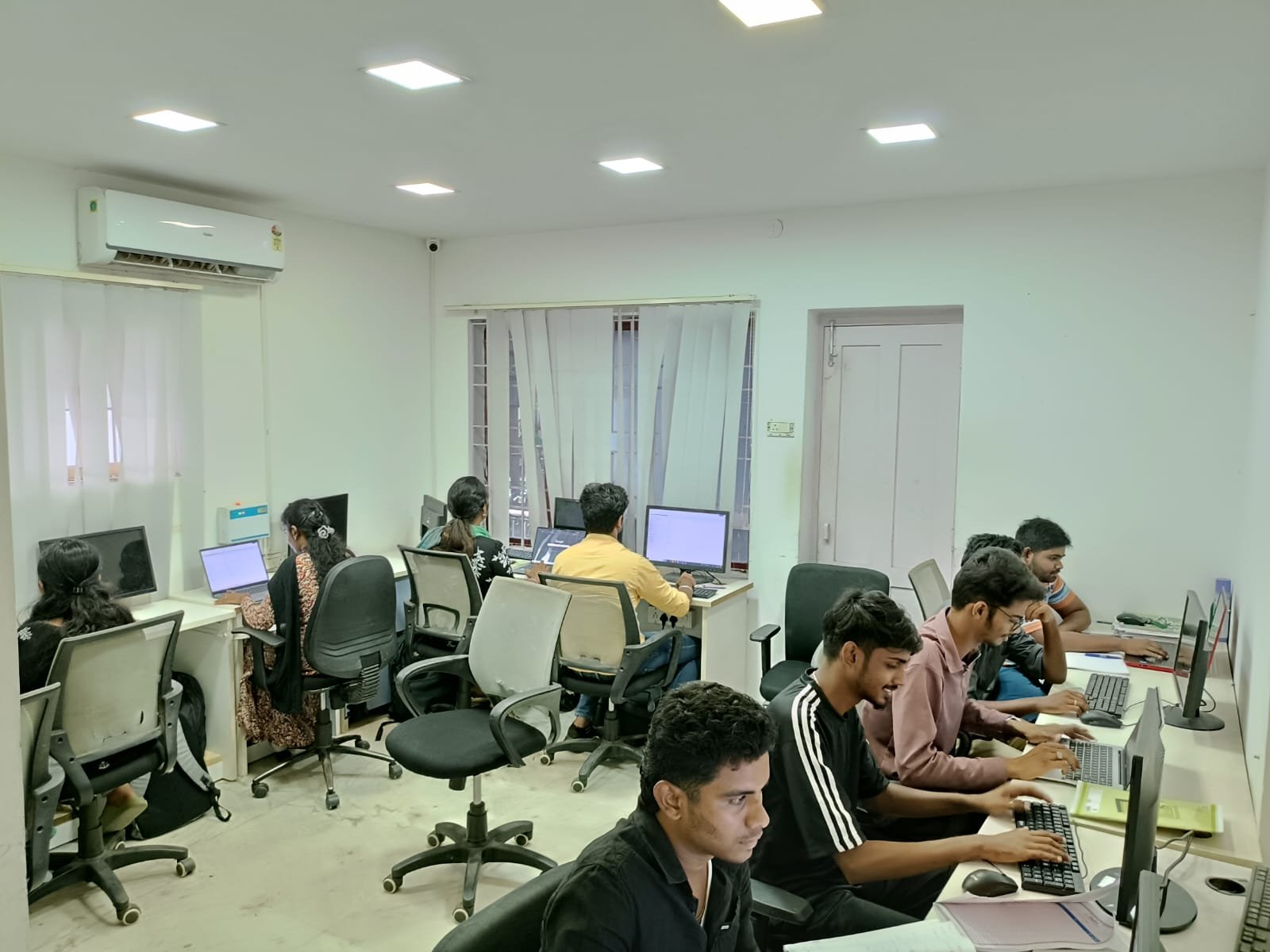 A full classroom at a Techmaax centre during a hands-on training session